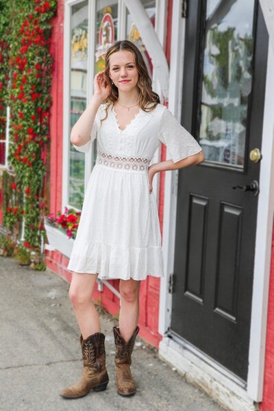 Girl standing in front of red building | Senior Session