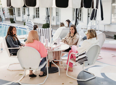 chasity campbell sitting with friends talking in palm springs