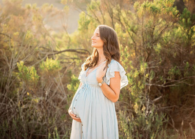 Gorgeous mama during her sunset maternity session in a San Diego field
