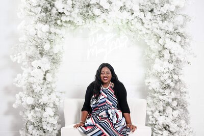 Wedding Planner at Cosima Restaurant in Baltimore Maryland standing in front of a luxury designed table