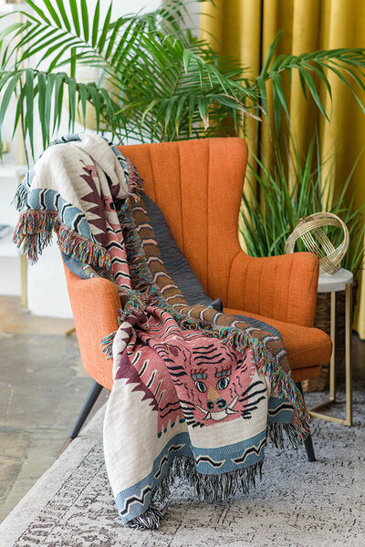 Blanket thrown across mid-century modern chair in DTLA studio