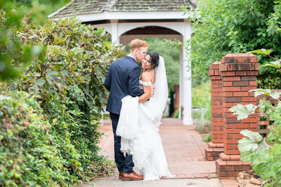 groom kissing bride on the cheek