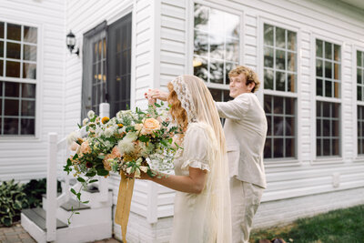 Jon twirls his bride, Peyton Curry, in celebration after their intimate backyard wedding ceremony in Richmond, Virginia. A joyful, candid moment captured by a film wedding photographer in a documentary-style wedding aesthetic.