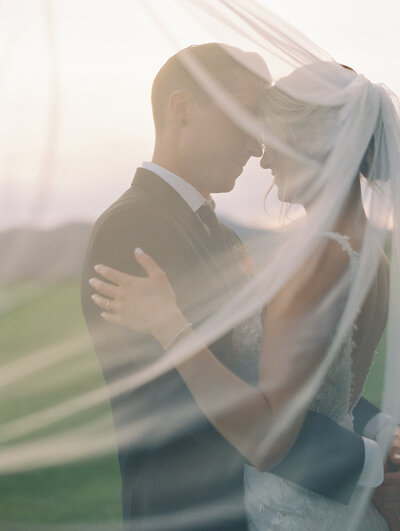Romantic veil photo with couple in Vermont