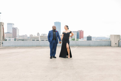 bride and groom smiling at each other during their session at the River Market Parking deck in Little Rock Arkansas