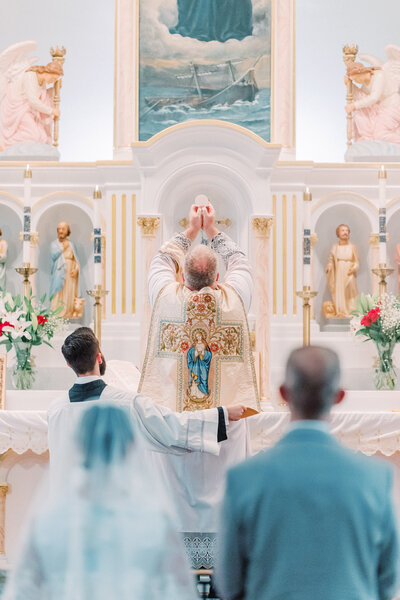 Elevation of the Host during Traditional Latin Mass wedding at Our Lady Help Christians in Buffalo