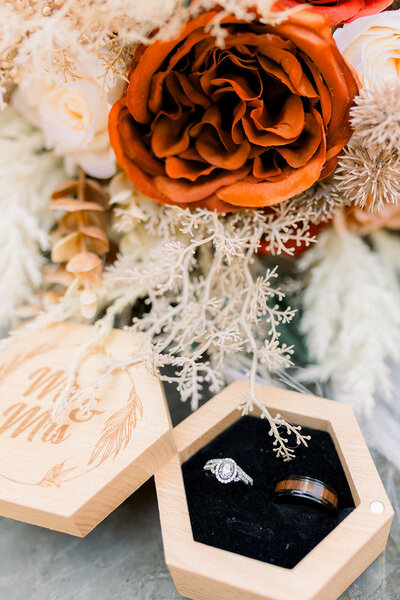 Detail photo of a wedding ringbox featuring boho florals