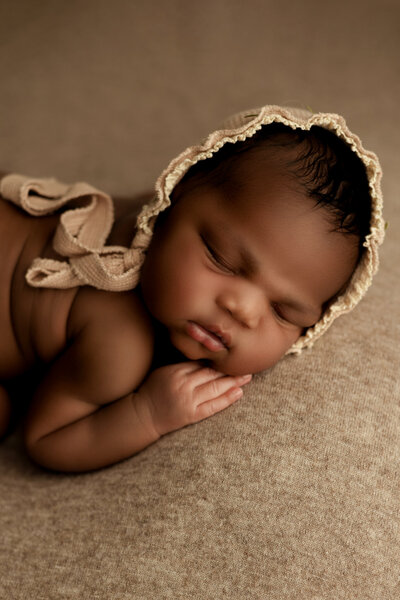 Newborn baby girl in neutral