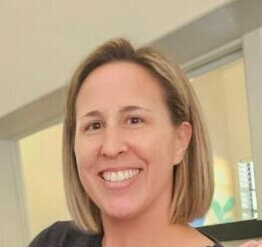 headshot of a smiling woman