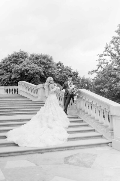 Bride and groom on steps at the olana in dallas