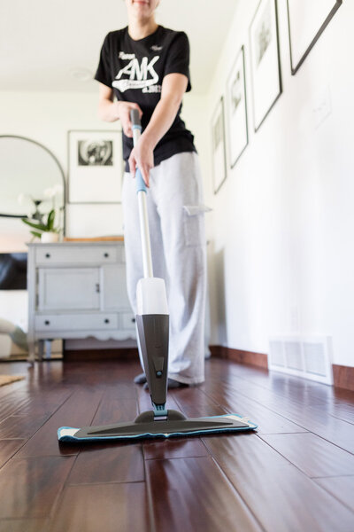 Professional Cleaner washing hard wood floors