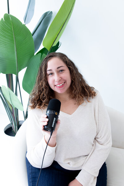 Pamela with microphone and laptop