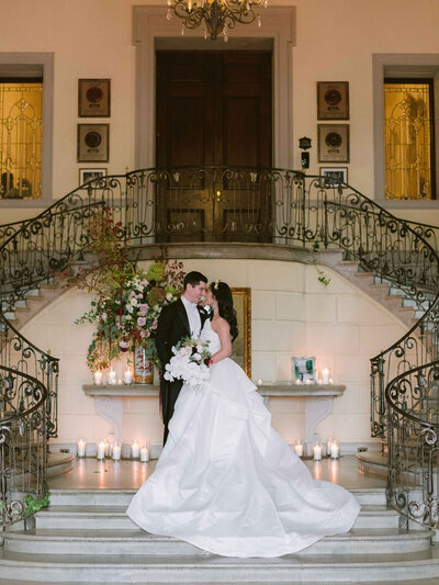 Oheka Castle Wedding Event Planner couple on front steps with candles