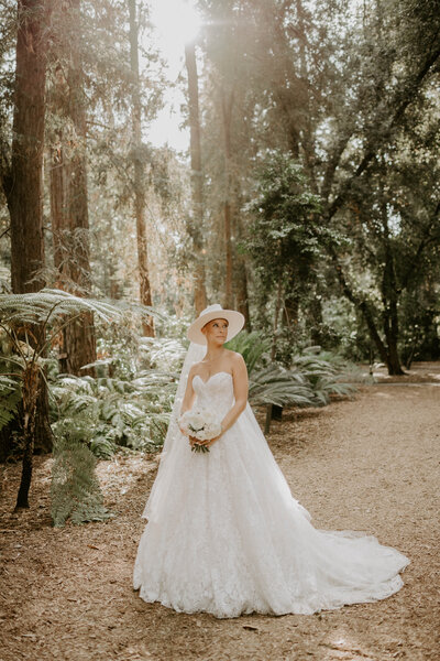 bride posing in forest