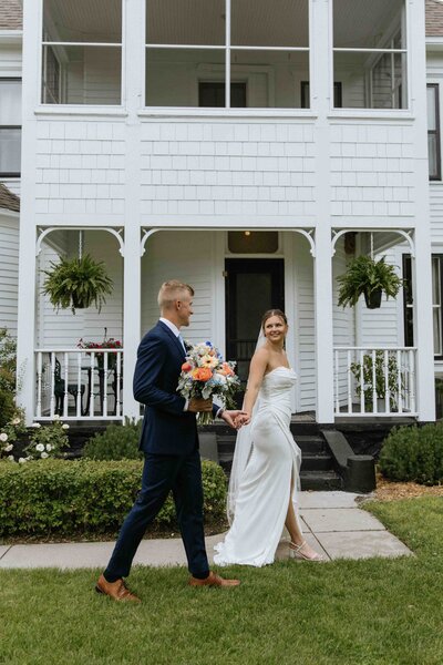 Bride and groom laughing close together  taken by fargo wedding photographer kiella lawrence