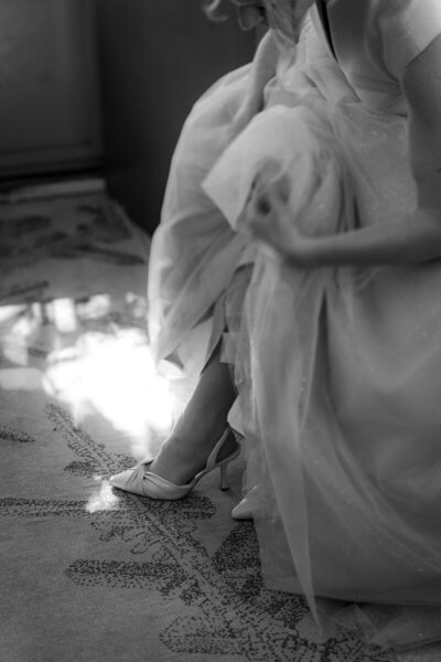 Bride Putting on Shoes