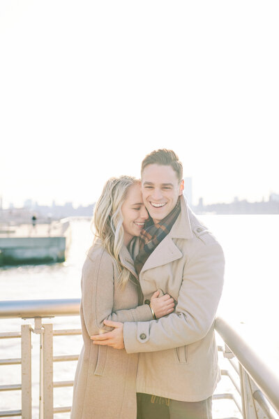 Couple rejoices after a successful Proposal in New York City, Gantry State Park.  Photography by Proposal Photographer Corey Lamar Photography