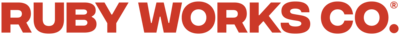 Bold, all-caps red text displaying 'Ruby Works Co.™' in a strong, modern font. This branded typography reflects the agency’s confident, strategic, and results-driven approach to branding, web design, and digital marketing for small businesses and creative professionals."