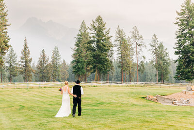 Bride and groom walking grounds at The Silver Knot in Ronan, MT