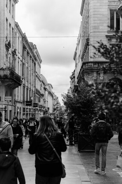 Black and white of people in a city walking