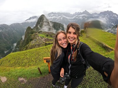 Jessie with a friend climbing a mountain