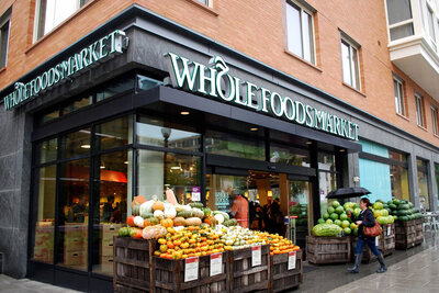 Whole Foods Market store front with fruits and vegetables
