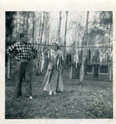 Baye Christensen with son Bob Christensen in front of Beachview Cabin