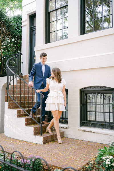 Bride and Groom walking down stairs in Georgetown during their engagement session in Washington DC