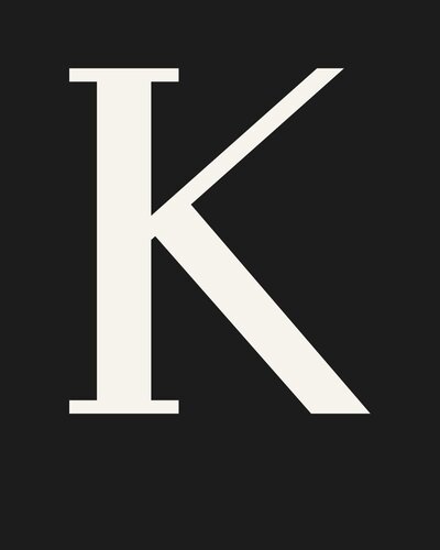 Minimalist black and white letter K icon representing a private client testimonial for Minneapolis online dating photography.