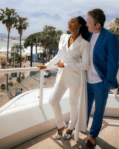 Stunning couple embrace on a balcony in Cannes