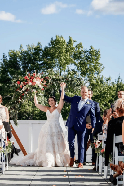 Manchester Country Club - Couple Walking Down Their Outdoor Wedding Aisle