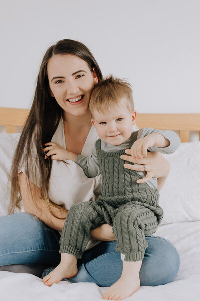Mother and toddler laughing together during lifestyle photography session in the High Peak