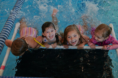 Little girls enjoying the pool, embracing the delights of water play and carefree moments