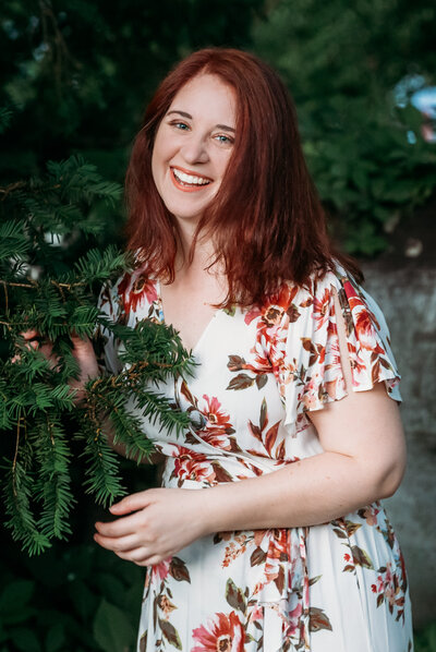A woman laughing at the camera