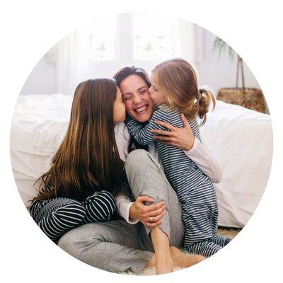 Mom with Daughters Kiss Circular