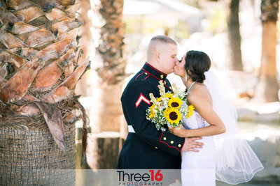Bride and Groom share a private kiss together