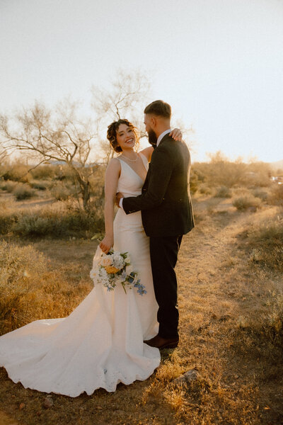 couple standing together at outdoor wedding day