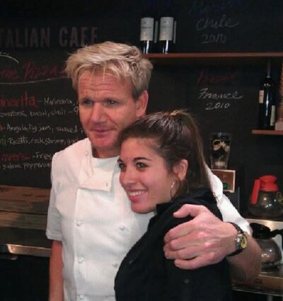 Gordon Ramsey and Genevieve hugging as she was a  contestant on kitchen nightmares.