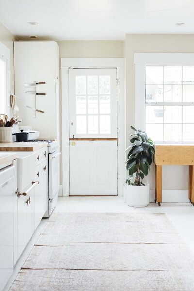 white kitchen with dutch door