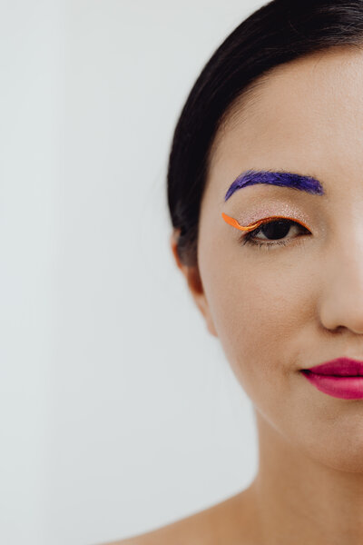 kaboompics_sensual-portrait-of-a-asian-woman-with-flowers-on-her-face-22886