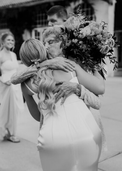Bride hugging grandma after wedding ceremony in Denver, CO