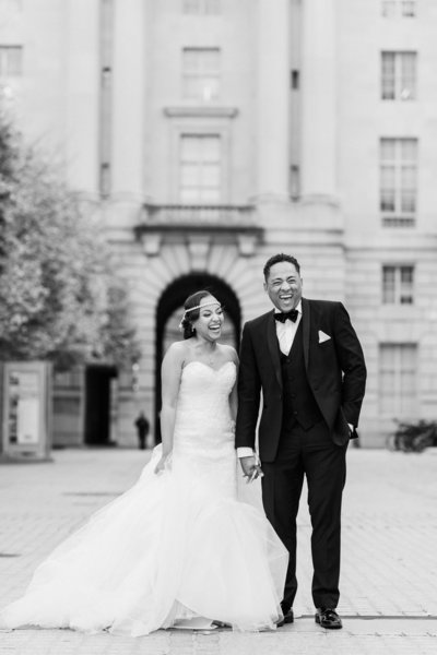 Bride and groom walk up memorial steps at their DC wedding