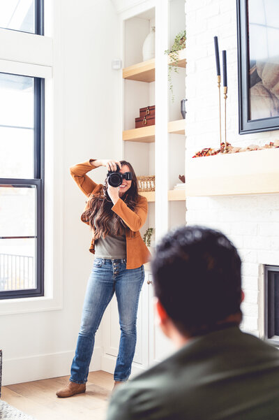An interior designer getting her lifestyle branding photos of her with furniture in Draper, utah