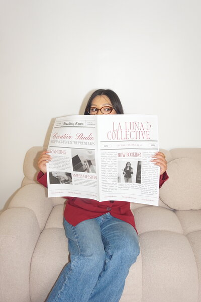 white couch next laptop and cup of water