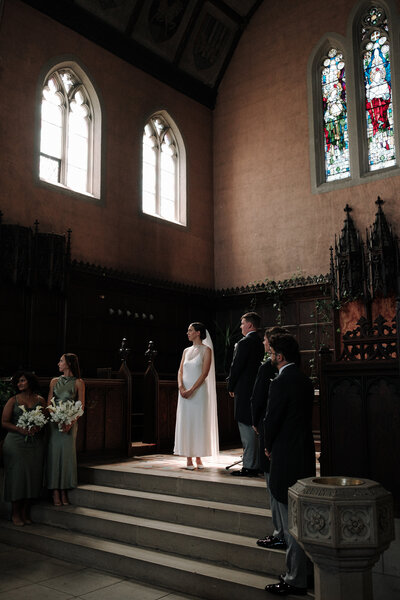 Church ceremony with incredible lighting upon the bride and groom