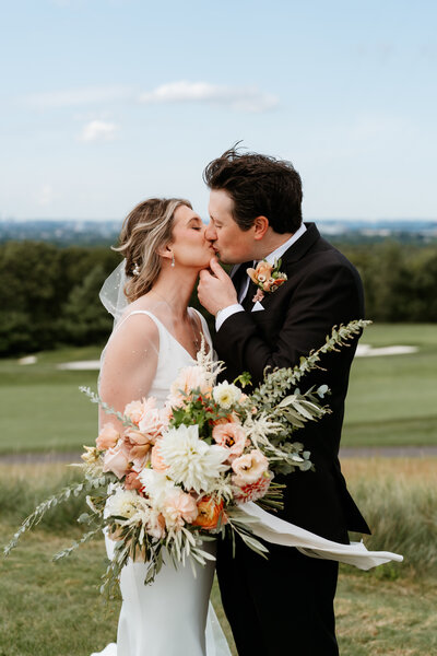 bride and groom kissing