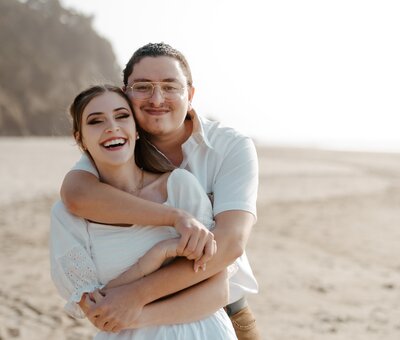 engaged couple hugging