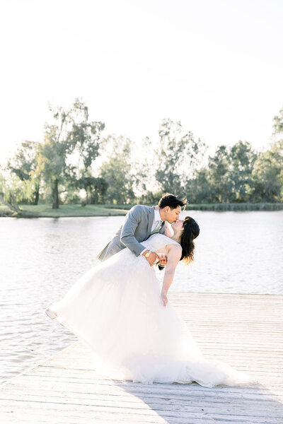 Bride and groom sunset portraits at the Wolf Lakes Park dock
