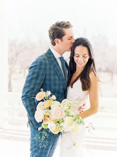 Bride and Groom embrace at the grand lady in texas