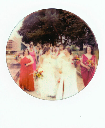 Close up of wedding invitation and other meaningful parts of the wedding, laid out on a table